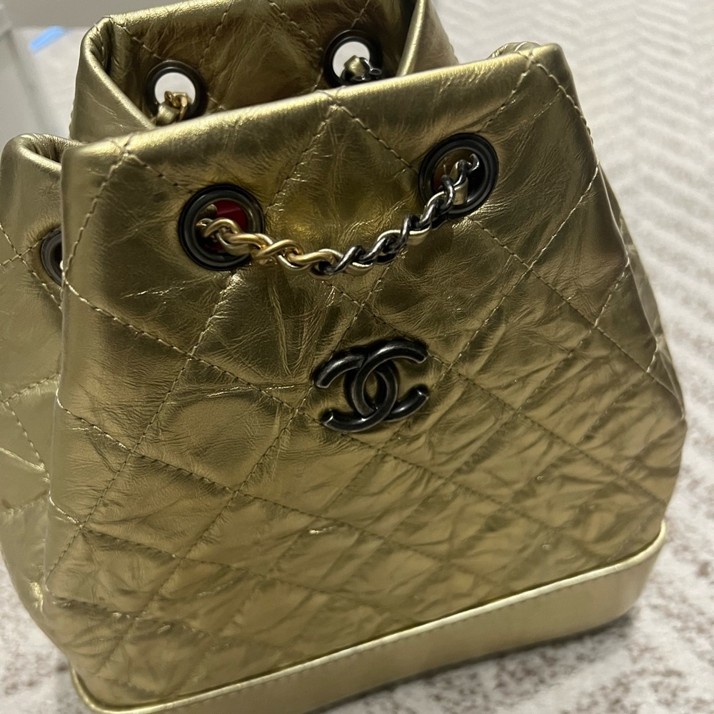 Gold Chanel bag pack with gold and silver chain straps